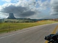 Devil`s Tower National Monument from a distance on a motorcycle