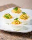 Deviled eggs garnished with parsley and paprika