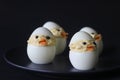 Devilled egg chicks prepared as Easter Eggs. Traditional celebration of making eggs as the symbol of new life and resurrection Royalty Free Stock Photo