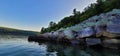 Baraboo quartzite tumbled rocks on lakeshore Devils lake state park by kayak Royalty Free Stock Photo