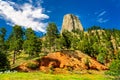 Devils Tower National Monument with red earth in the foreground Royalty Free Stock Photo