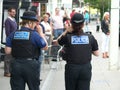 Devon and Cornwall police officer and PCSO walking the streets of North Devon Royalty Free Stock Photo