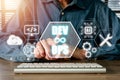 DevOps concept, Man hand touching DevOps icon on VR screen on desk, Methodology development operations agil programming technology