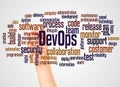 DevOps word cloud and hand with marker concept