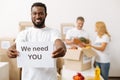 Devoted nice gentleman holding motivating poster