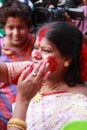 Devotee apply sindhoor during Durga Puja festival Royalty Free Stock Photo