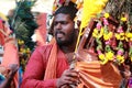 Devotee carries decorated arch in his shoulder and dances in the Thaipusam festival