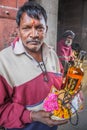 Devotee offering liquor