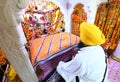 Devotee pay obeisance at a holy Gurudwara