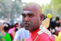 Devotee with shaved head looks as he participates in the Thaipusam festival