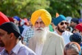 Devotee Sikh with yellow turban marching