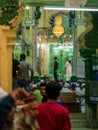 Devotees gathering wearing traditional Taqiyah to offer prayers during holy month of Ramadan or Ramzan at Local Mosque