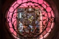 Devotees seen through artistically carved window pray at Jade Emperor Pagoda.