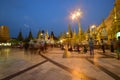 Devotees standing & sitting at Crowded Shwedagon Pagoda in the evening during sunset