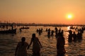 Devotees taking holy dip in the river Ganges during the Kumbh Mela