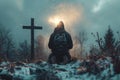 Devout catholic man bowing in prayer before crucifix on hill, seeking divine guidance and strength Royalty Free Stock Photo