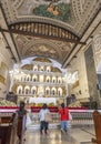 Devout Filipino worshipers of all ages,kneel before the altar,inside the Basilica of Saint Nino,Cebu\'s oldest church