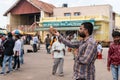 A devout Hindu pilgrim lighting a flame at the ancient Chamundeshwari temple in Chamundi