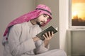 Devout muslim man reads Quran at home Royalty Free Stock Photo