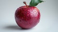 Dew-covered red apple with a single green leaf isolated on white background Royalty Free Stock Photo