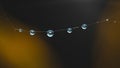 Dew drops hanging on spider web reflecting sunlight Royalty Free Stock Photo