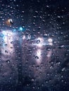 Dew on windows + purple lights + Rain