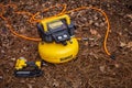 DeWalt yellow power tool with an orange cord Royalty Free Stock Photo