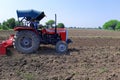 22-10-2021, Dewas, M.P. India. Plowing the field with a tractor, farmers preparing the field before sowing the crop, a new