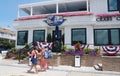 Dewey Beach, Delaware, U.S - July 4, 2023 - People walking in front of the famous Starboard Claw restaurant and bar