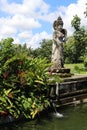 Dewi Sri or Shridevi the rice goddess. Stone figure of one of balinese godness. Water Palace of Tirta Gangga in East Bali,