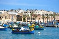 Dghajsa fishing boats moored in Marsaxlokk harbour, Malta. Royalty Free Stock Photo