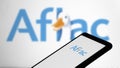 Dhaka, Bangladesh- 24 February 2024: Aflac logo is displayed on smartphone