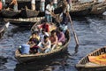 Dhaka, Bangladesh, February 24 2017: Passengers arrive in a wooden taxi boat at the terminal Royalty Free Stock Photo