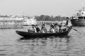 Dhaka, Bangladesh, February 24 2017: Wooden taxi boat with passengers on the river Royalty Free Stock Photo