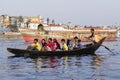 Dhaka, Bangladesh, February 24 2017: Wooden taxi boat with passengers on the river Royalty Free Stock Photo