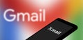 Dhaka, Bangladesh- 27 February 2024: X mail logo displayed on smartphone and Gmail logo on the background