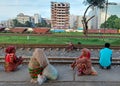 Dhaka, Bangladesh - 11.07.2021: Helpless poor hungry people sitting on a railway during corona lock down in bangladesh with no