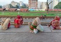 Dhaka, Bangladesh - 11.07.2021: Helpless poor hungry people sitting on a railway during corona lock down in bangladesh with no