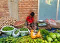 Dhaka,Bangladesh-July 19,2020:Very young child selling vegetables in Bangladesh during corona virus pandemic in order to provide