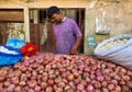 Dhaka,Bangladesh-July 19,2020:Young man in mask selling vegetables and onions during corona virus pandemic in Bangladesh to