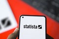 Dhaka, Bangladesh- 20 March 2024: Statista.com logo is displayed on smartphone Royalty Free Stock Photo