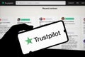 Dhaka, Bangladesh- 19 March 2024: Trustpilot logo is displayed on smartphone
