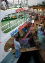 Dhaka, Bangladesh: People boarding a ferry at the dock at Sadarghat in Dhaka