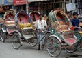 Dhaka, Bangladesh: A rickshaw driver waits in line