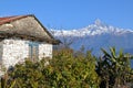 DHAMPUS, NEPAL: Traditional house in Dhampus village near Pokhara with Machapuchare Peak in the background