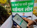 dhani loan application displayed on mobile phone screen during promotional activity on road in india dec 2019