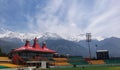 The Dharamsala stadium standing in between snow coverd peaks Royalty Free Stock Photo