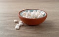 DHEA pills in a bowl on a table side view Royalty Free Stock Photo