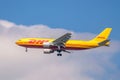 DHL cargo plane flying high in the blue sky Royalty Free Stock Photo