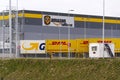 DHL and GLS shipping containers in front of Amazon logistics building on March 12, 2017 in Dobroviz, Czech republic